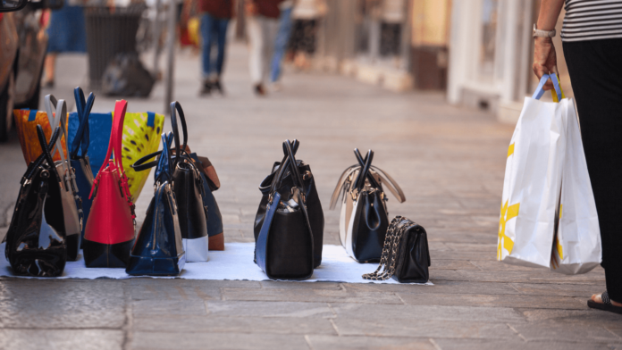 Image showing designer bags hawked on a busy street